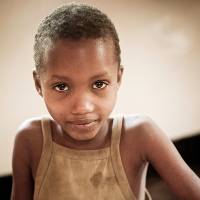 A young girl doing schoolwork
