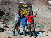 Trekkers and porter at Arrow Glacier |  <i>Kyle Super</i>