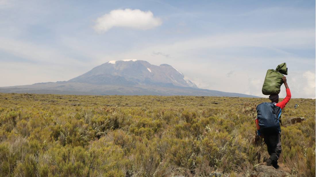 Porter heading towards Kilimanjaro | <i>Kyle Super</i>
