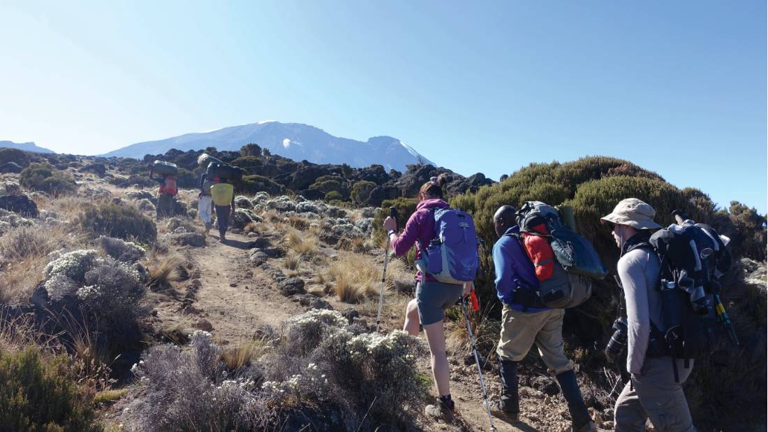 Trekkers enjoying the sunshine on the ascent | <i>Kyle Super</i>