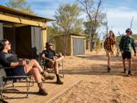 Trekkers relaxing on the porch of their campsites |  <i>Shaana McNaught</i>