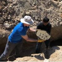 Trekkers helping to build the foundations for new classrooms in Lura village