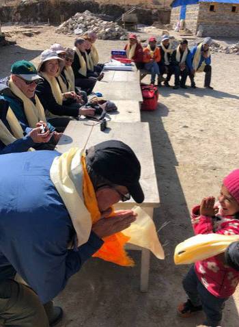Travellers interacting with locals in Lura