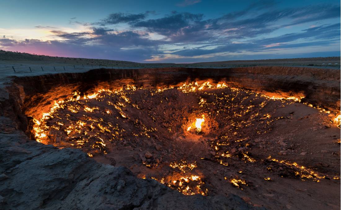 Turkmenistan's Darvaza Gas Crater, also known as the 'Door to Hell', at sunset | <i>Richard I'Anson</i>
