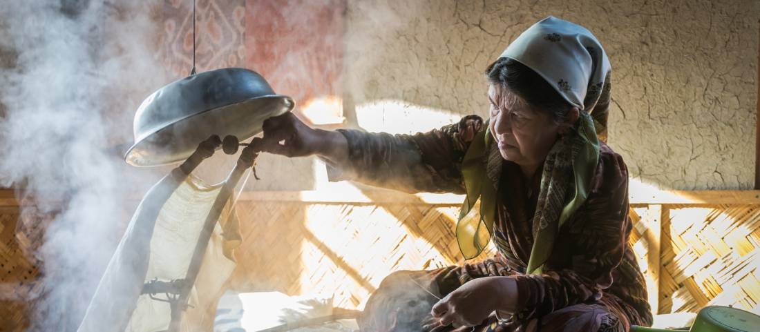 Local woman working in a silk factory in Samarkand |  Alesha Bradford