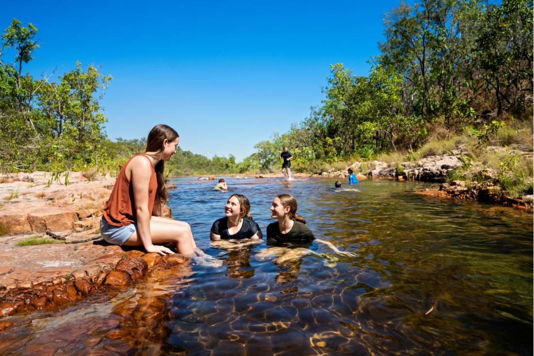 Kids cooling off during a walk in Kakadu National Park | <i>Tourism NT/Shaana McNaught</i>