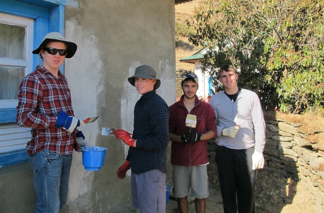 Painting at a community project in Nepal | <i>Greg Pike</i>