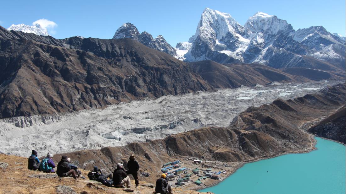 Trekking group taking a rest after walking to the summit of Gokyo Ri | <i>Ayla Rowe</i>