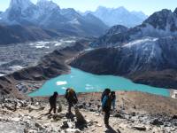 Trekkers descending Gokyo Ri with stunning views of Gokyo Lake |  <i>Ayla Rowe</i>