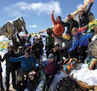 Happy group of trekkers atop of the Renjo La, Nepal -  Photo: Scott Cardwell