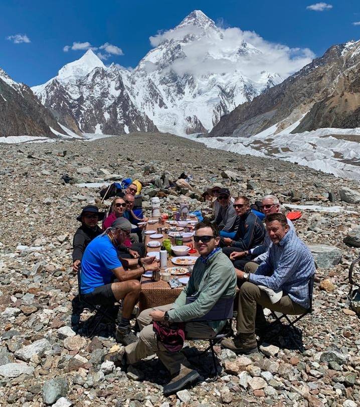 Trekkers dining with a mountainous backdrop |  <i>Soren Kruse Ledet</i>