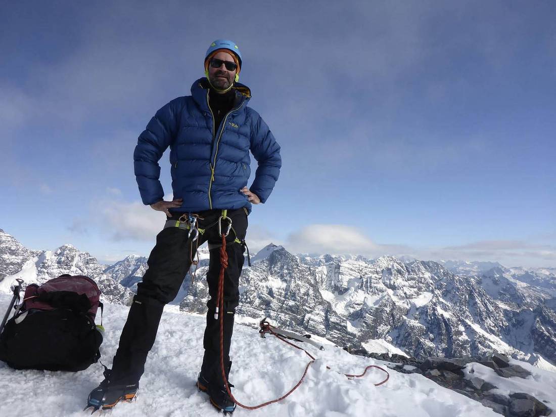 Summit sucess! Mountaineer at the top of Pequeno Alpamayo (5425m) | <i>Anthony Bohm</i>