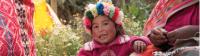 The young children of Huilloc spend the day by their mothers side as she sells her handcrafted weaving products |  Mark Tipple